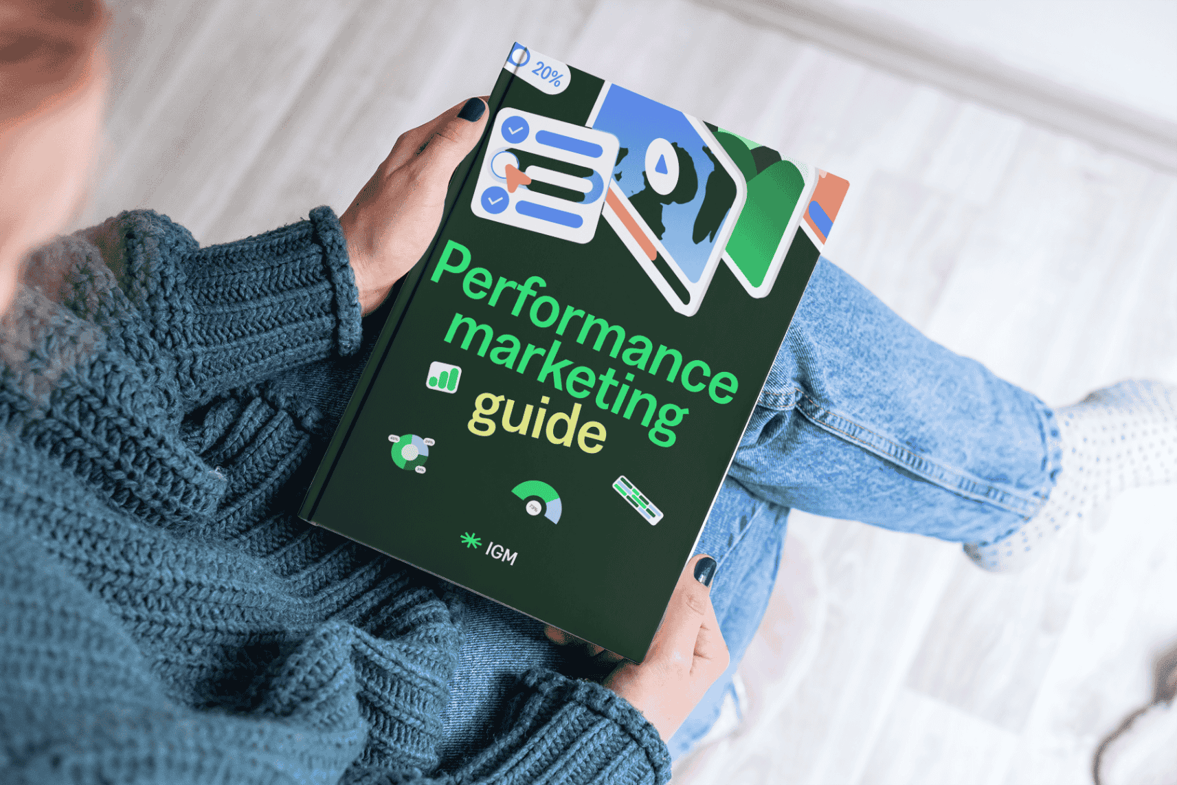 Person holder bok med tittelen Performance marketing guide om digital markedsføring og annonsering